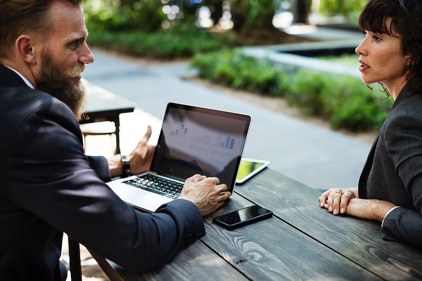 Business Meeting Outdoors with Laptop and Smartphone