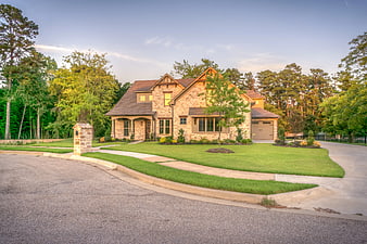Modern Brick House with Green Lawn and Trees