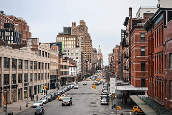 Wide City Street View with Brick Buildings and Traffic