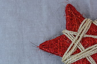 Red Glitter Christmas Star Ornament With Twine On Gray Background