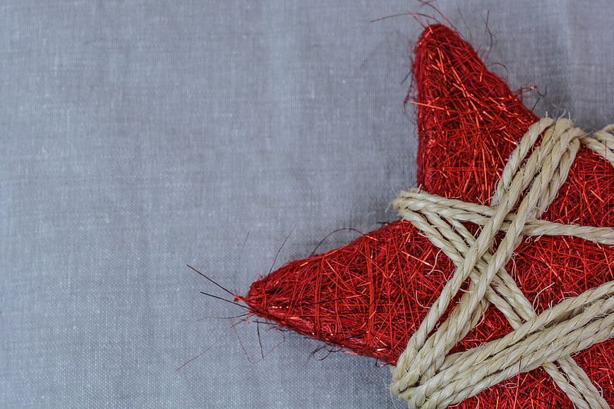 Red Glitter Christmas Star Ornament With Twine On Gray Background