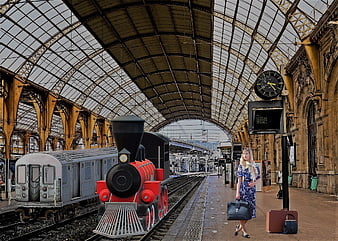 Woman with vintage luggage at historic train station platform