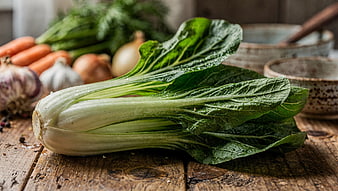 Fresh Bok Choy on Rustic Wooden Table with Vegetables