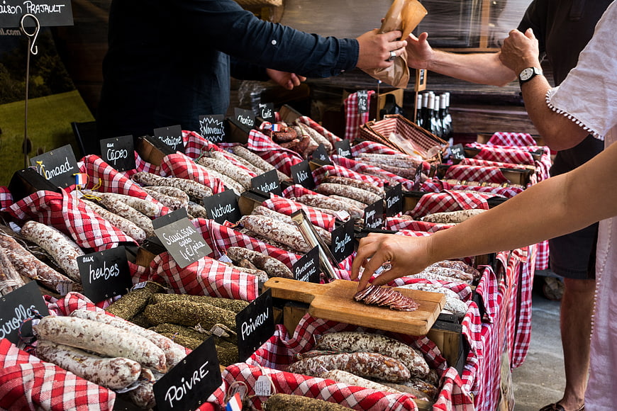 Fresh artisanal sausages at a French outdoor market stall