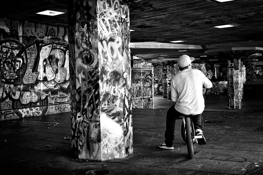 BMX Rider in Graffiti Covered Underground Skatepark