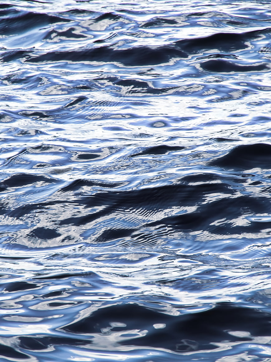 Close-up of rippling blue water surface texture