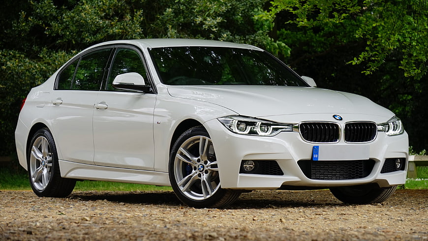 White BMW 3 Series Sedan Parked on Gravel