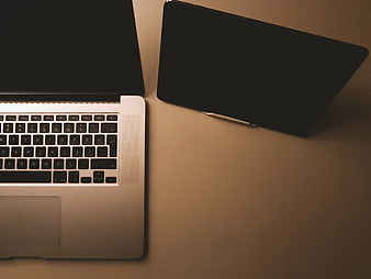 Top View of Laptop and Tablet on Desk