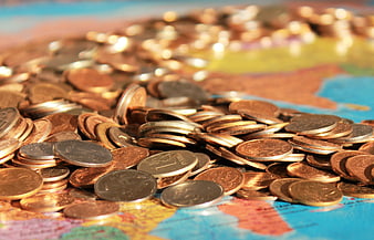 Pile of Russian Ruble Coins on a World Map