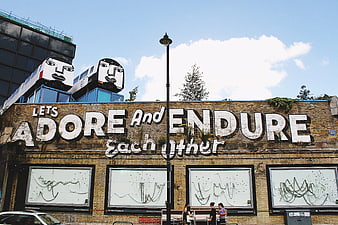 Urban Street Art Mural with Train Sculptures and Inspirational Quote