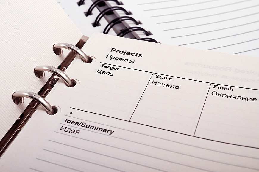 Close-up of Project Planner Notebook with Russian Text