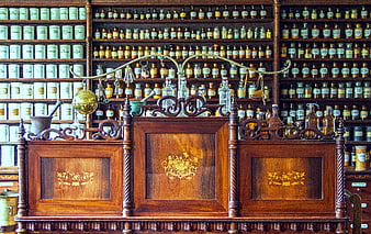 Historical Pharmacy Counter with Antique Bottles and Wooden Inlays