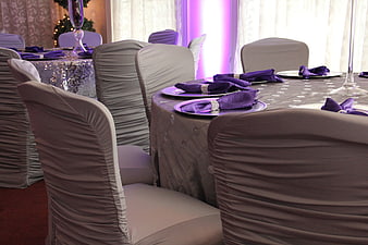 Elegant purple and silver wedding reception table setting