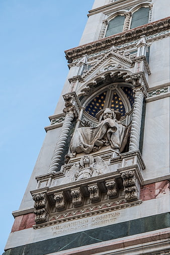 Low angle view of Valeriano statue on Florence Cathedral facade