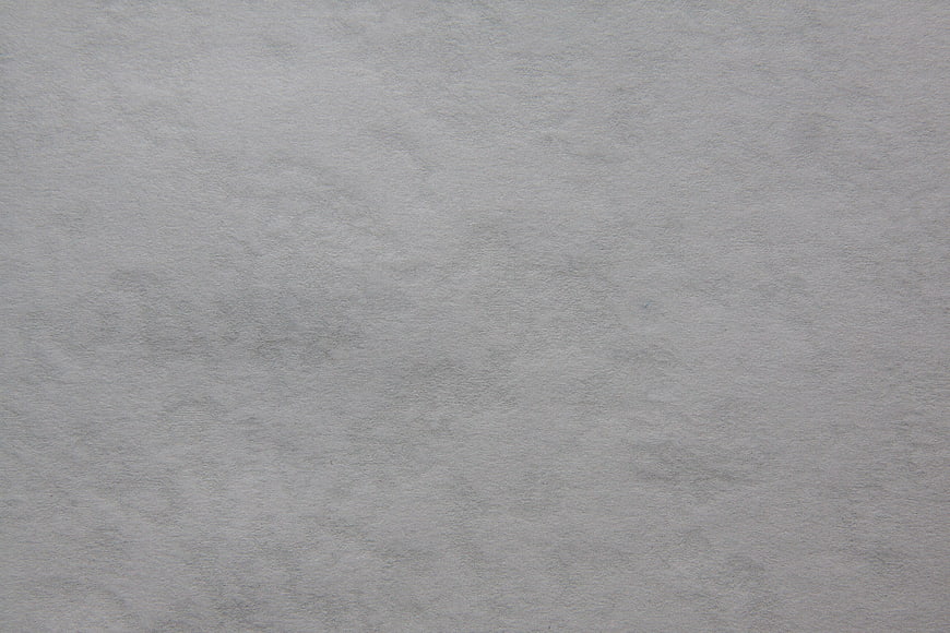 Gray textured paper background for design and copy space