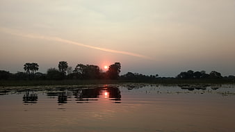Sunset Reflection Over Okavango Delta Water Landscape