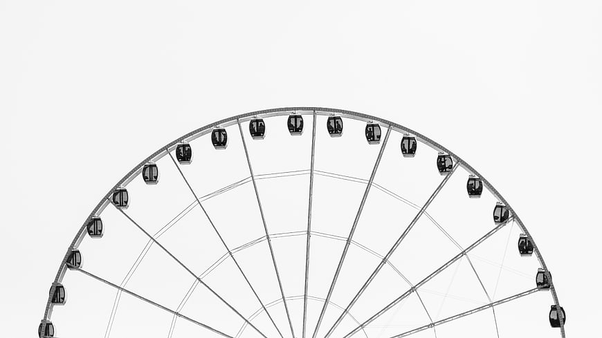 Minimalist Black and White Ferris Wheel Against White Sky