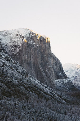 Snow-Capped Granite Mountain Peak at Golden Hour