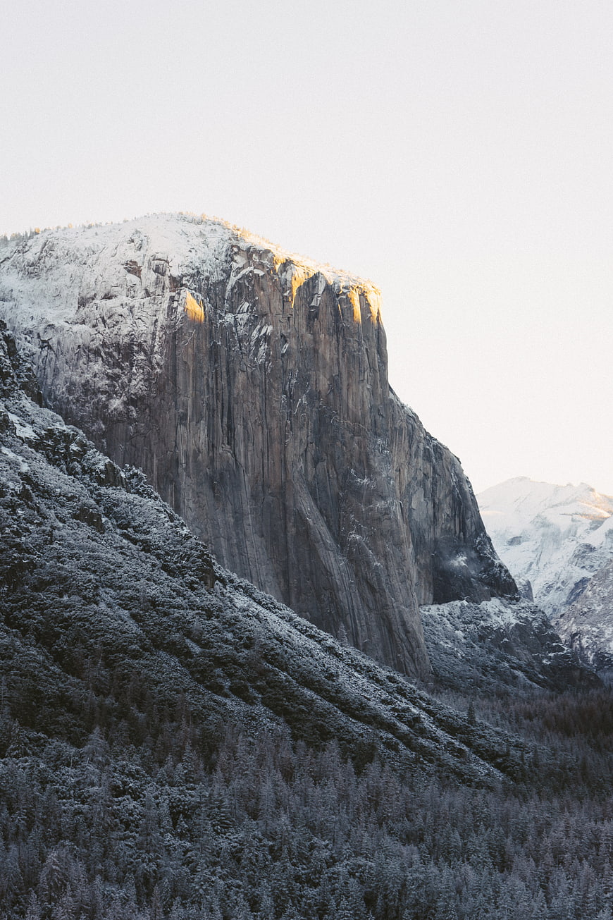 Snow-Capped Granite Mountain Peak at Golden Hour
