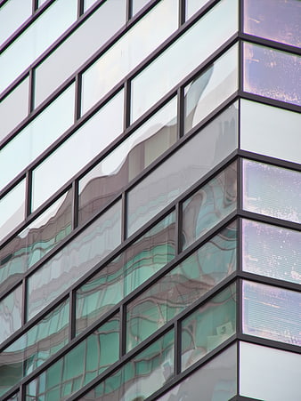 Modern Glass Building Facade with Abstract Reflections