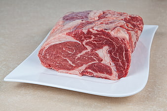 Raw Beef Roast on White Plate