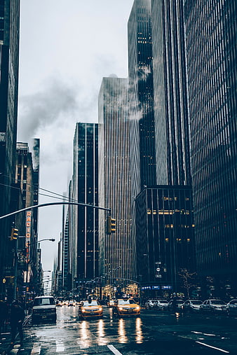 Rainy New York City Street with Yellow Taxis and Skyscrapers