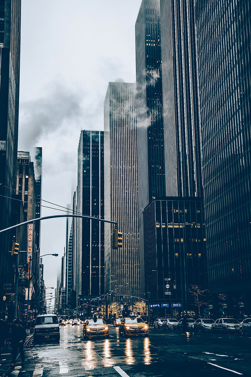 Rainy New York City Street with Yellow Taxis and Skyscrapers