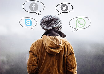 Person with social media icons in thought bubbles