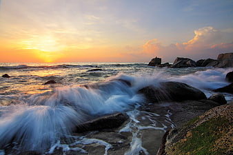 Long Exposure Sunset Over Rocky Ocean Coastline