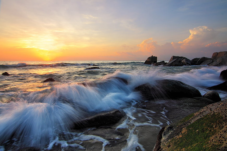 Long Exposure Sunset Over Rocky Ocean Coastline