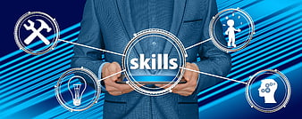 Businessman holding tablet with skills concept icons