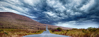 Dramatic Stormy Sky Over Winding Rural Road