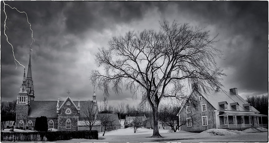 Dramatic Black and White Church and House with Lightning