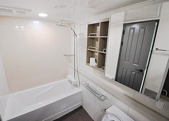 Modern White Bathroom Interior With Bathtub And Shower