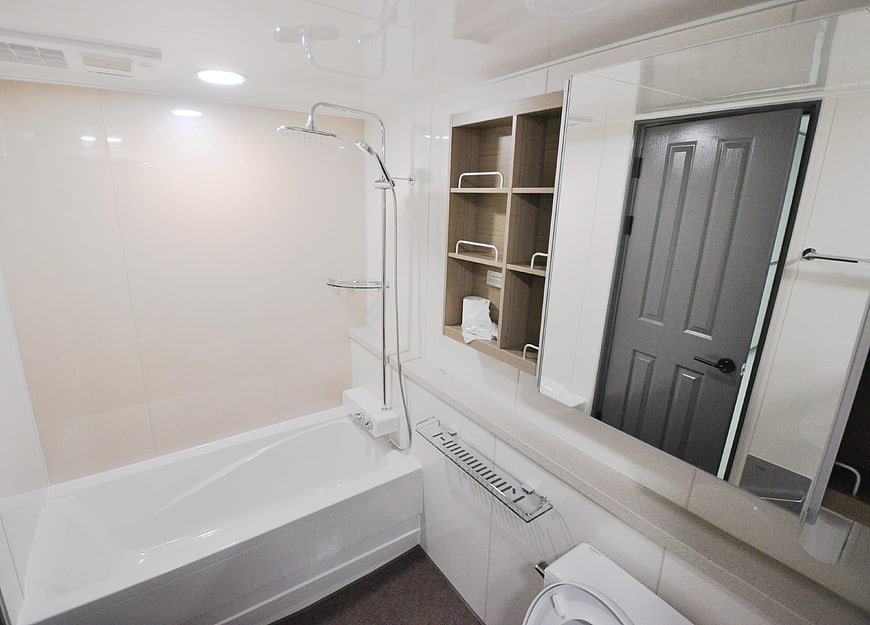 Modern White Bathroom Interior With Bathtub And Shower