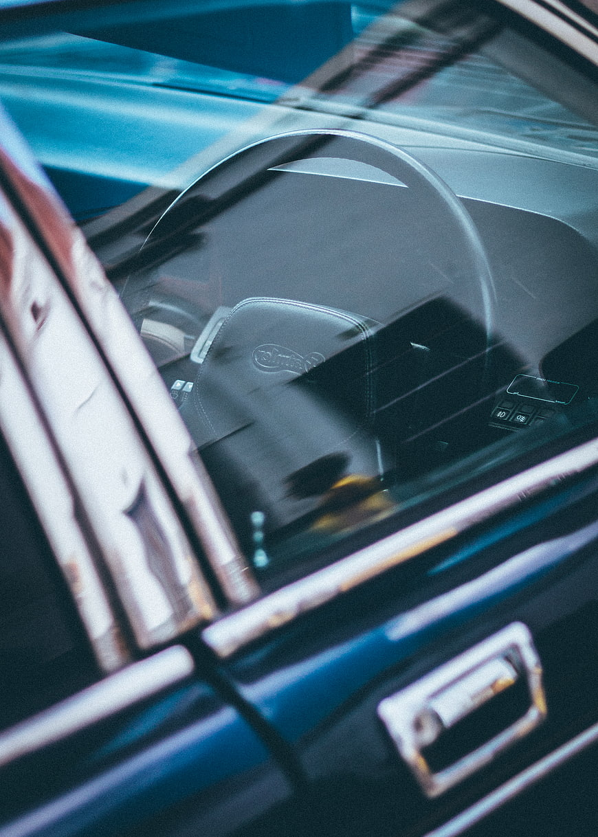 Close-up of vintage car interior through window