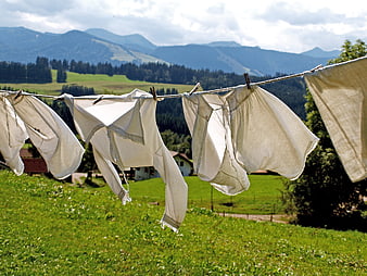 White Underwear Drying on Clothesline in Alpine Meadow