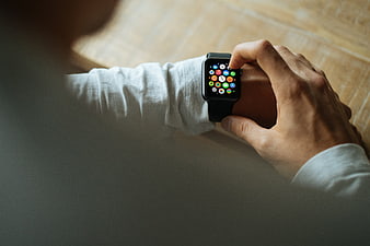 Person Interacting With Smartwatch On Wrist