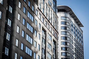 Modern Skyscrapers with Glass Facades Against Blue Sky