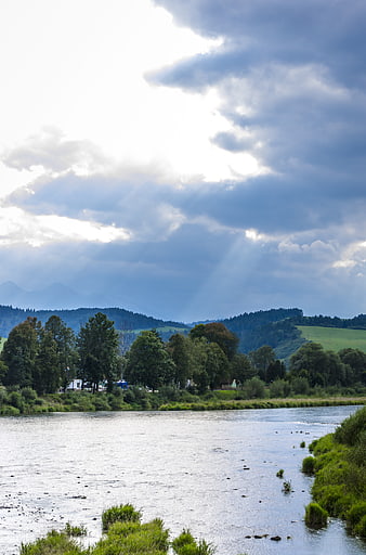 Dramatic River Landscape with Sunbeams and Mountains