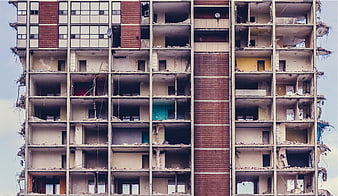 Demolished Apartment Building Facade with Exposed Rooms