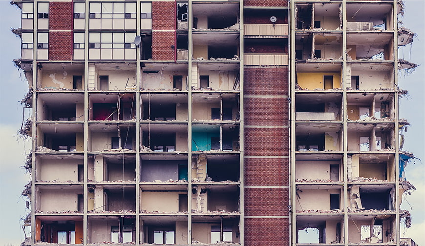 Demolished Apartment Building Facade with Exposed Rooms