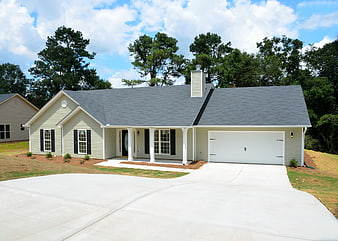 New suburban home with gray roof and white garage