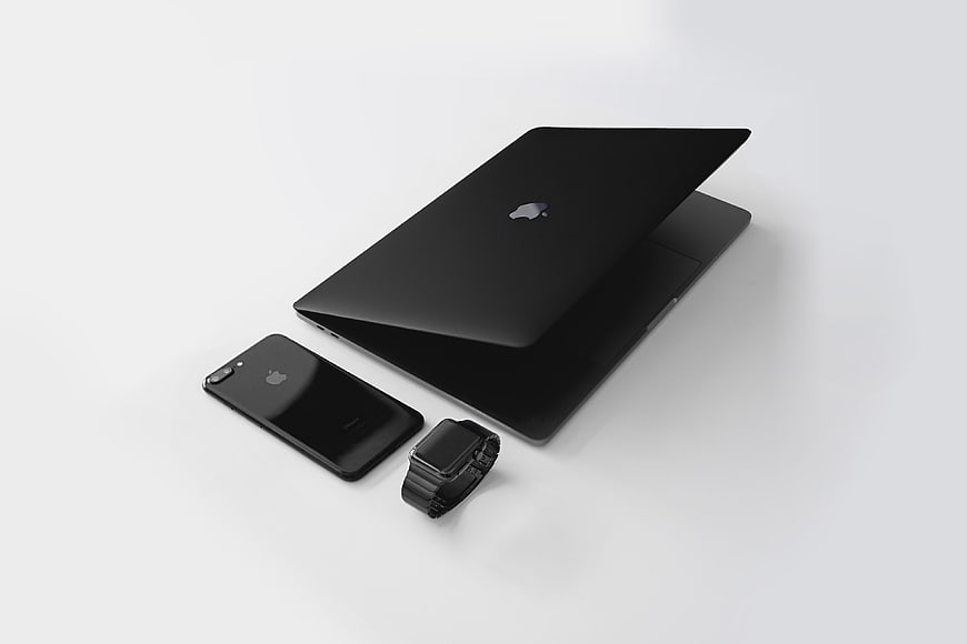 Black Apple Ecosystem: Laptop, iPhone, and Watch on White Background