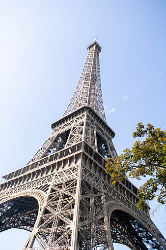 Low angle view of Eiffel Tower against blue sky