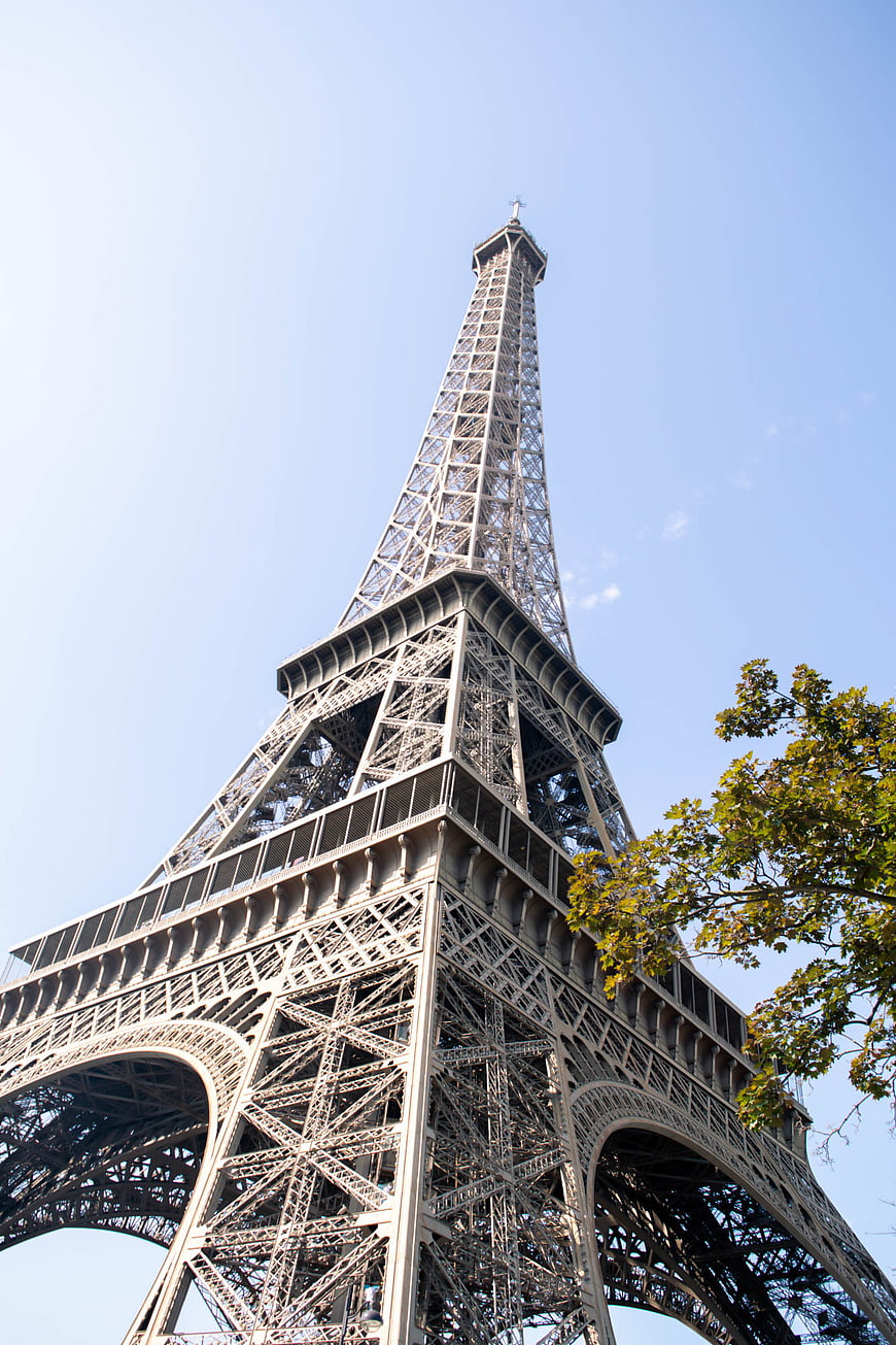 Low angle view of Eiffel Tower against blue sky