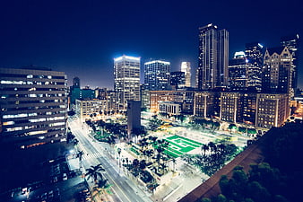 Nighttime Cityscape with Illuminated Skyscrapers and Park