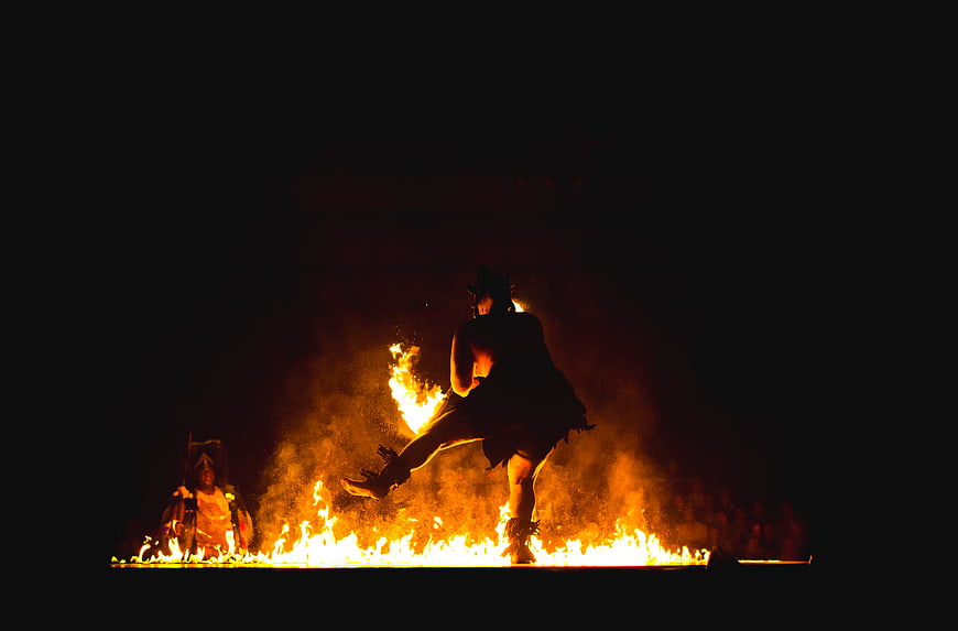 Silhouette of Fire Dancer Performing at Night