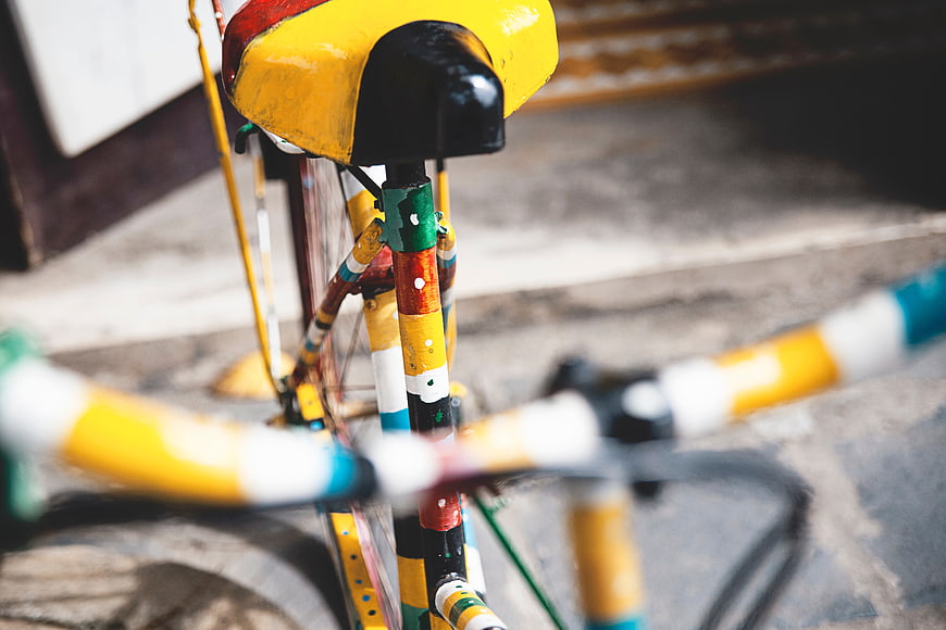 Close-up of Colorful Hand-Painted Bicycle Seat and Frame