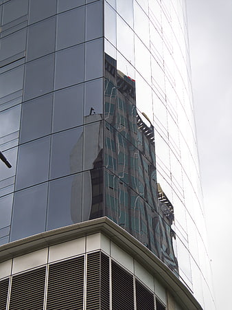 Modern Glass Building Facade with Reflections